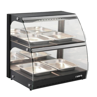 Fristående SARO NELSON Värmemonter i glas och svart metall med matbehållare.